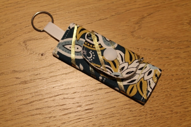 Mini pochette/porte clé feuillage or